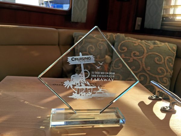 The Ocean Navigator magazine and Cruising Outpost magazine trophies that Nordhavn 47 won